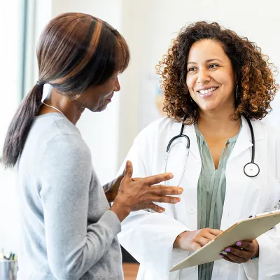 women doctor talking to patient